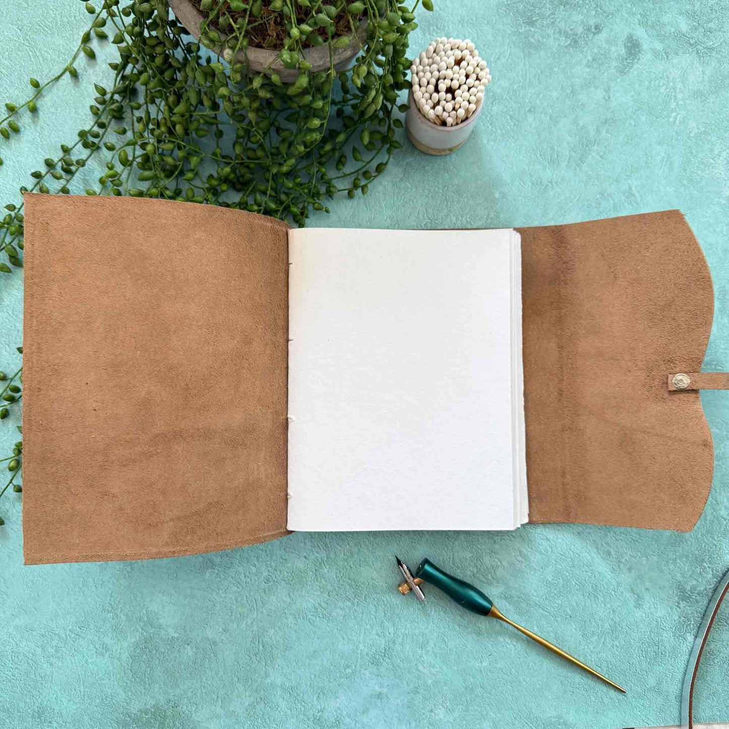 Handmade leather notebook with blank pages and tie
