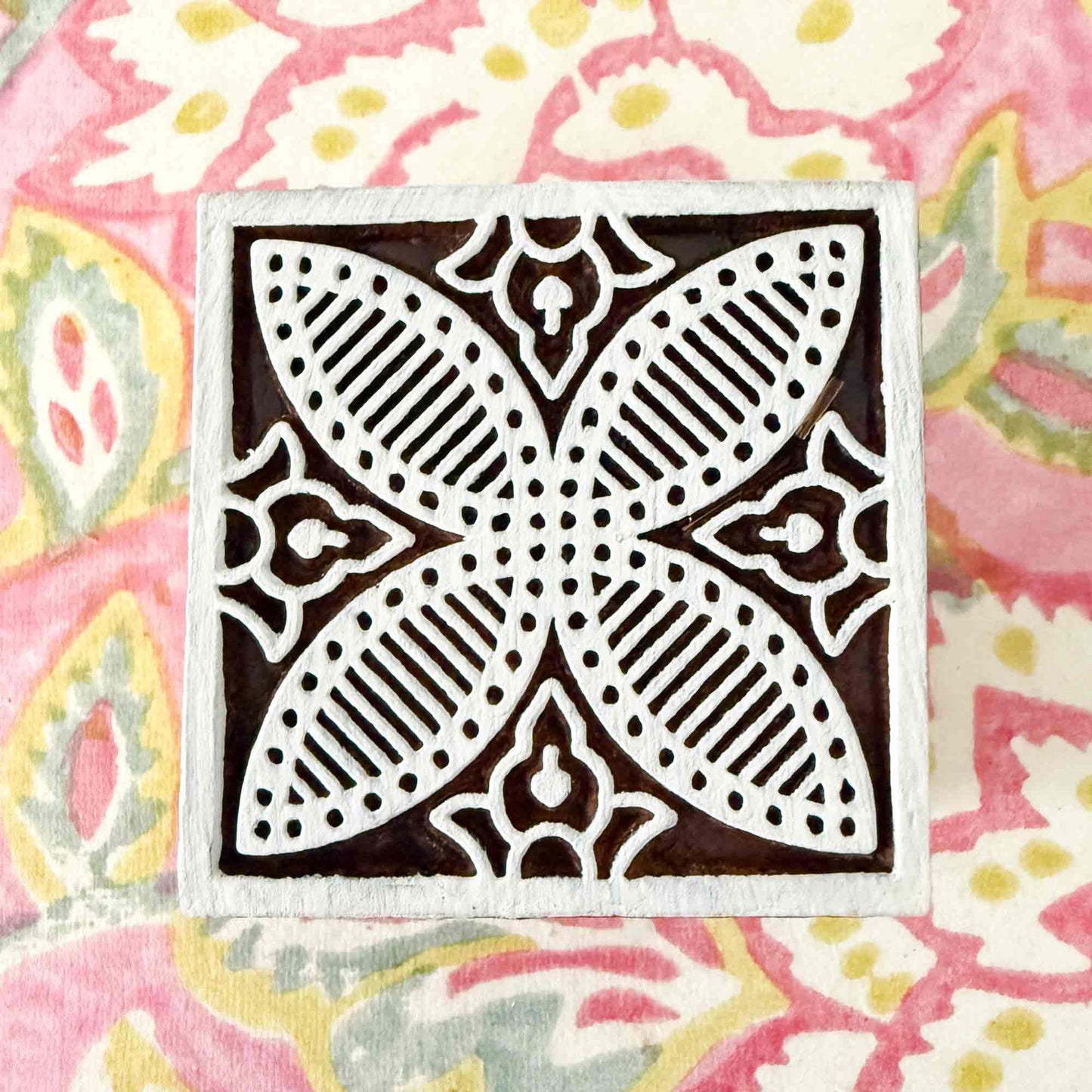 decorative tile stamp made from wood.