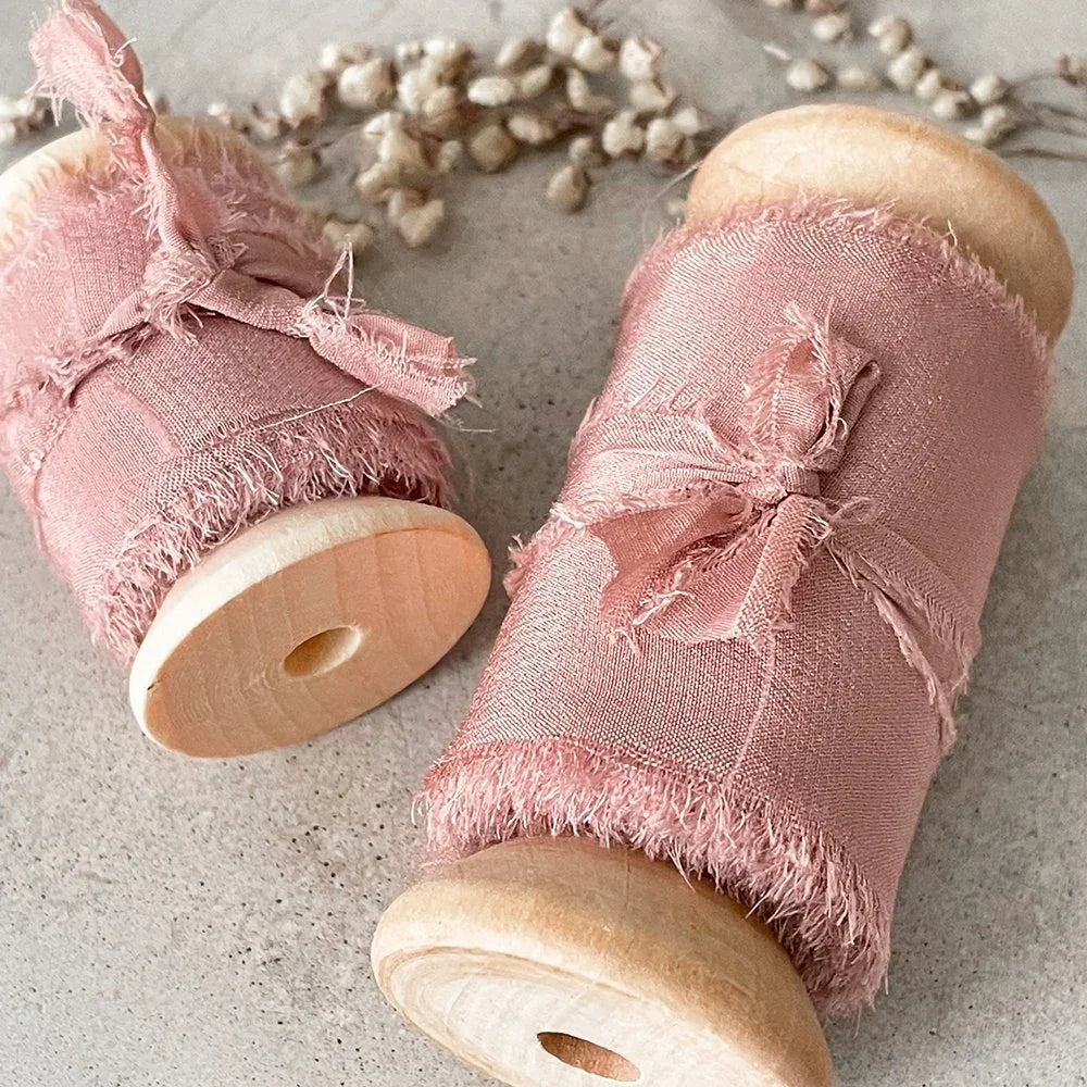 Blush Pink Silk Ribbon for crafts. Fine habotai silk ribbon with a frayed edge. Sold on a wooden reel. 2 widths available. By The Natural Paper Company