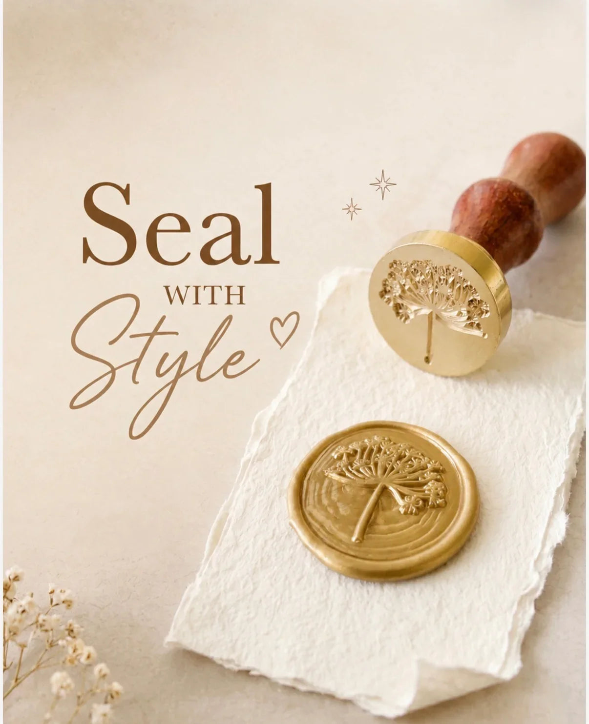 Close-up photograph of a gold wax seal featuring an intricate cow parsley floral impression, pressed onto deckle-edged handmade paper. Beside it rests the brass seal stamp with a turned wooden handle. Overlaid text: “Seal with Style”. Soft warm tones, dried flowers, from The Natural Paper Company.