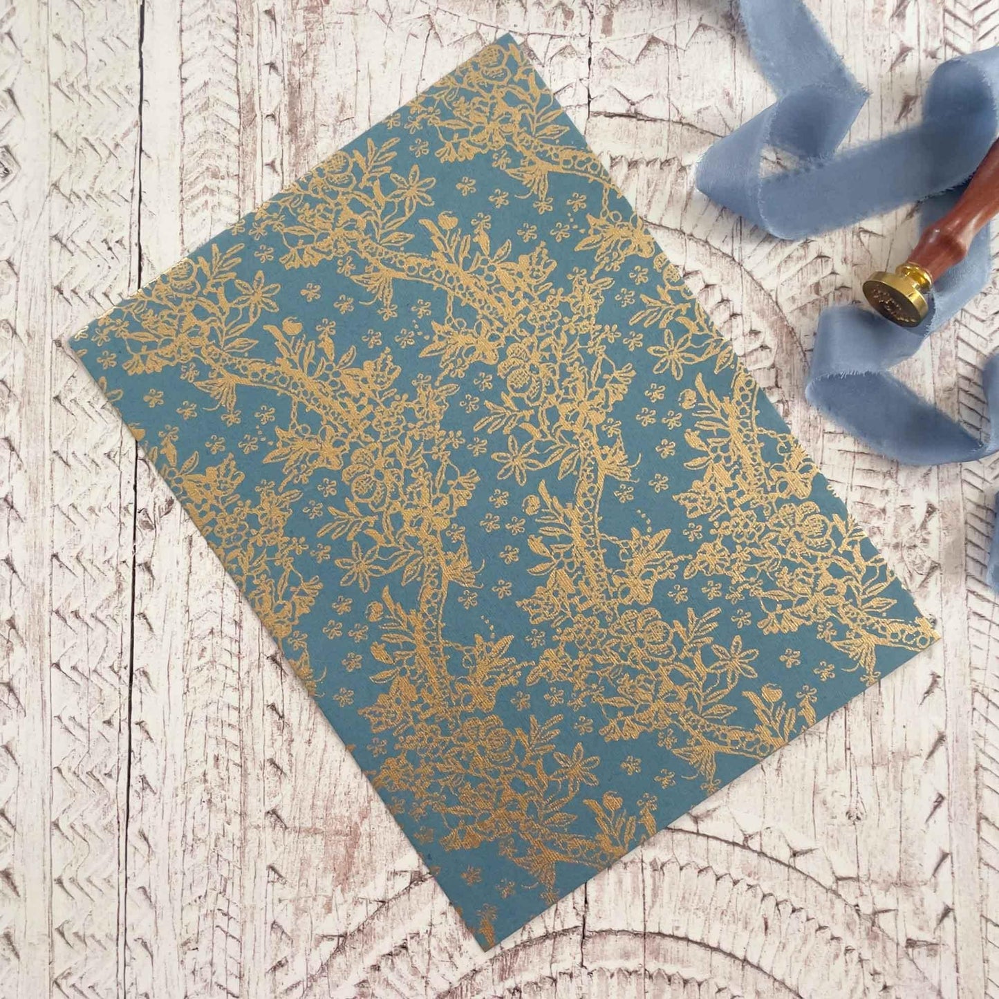 A4 patterned paper made from recycled cotton rag fibres. Airforce blue and gold
