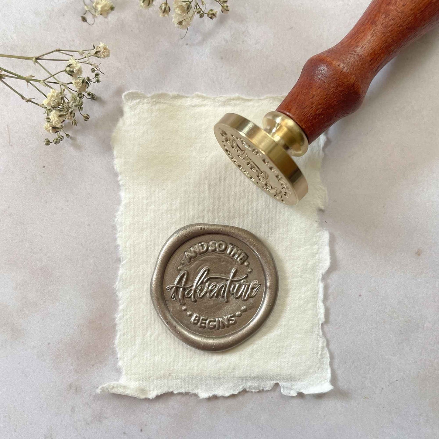And So The Adventure Begins sealing wax stamp for making wedding invitation wax seals. By The Natural Paper Company