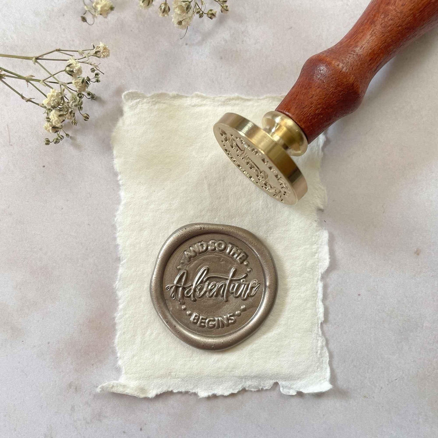 And So The Adventure Begins sealing wax stamp for making wedding invitation wax seals. By The Natural Paper Company