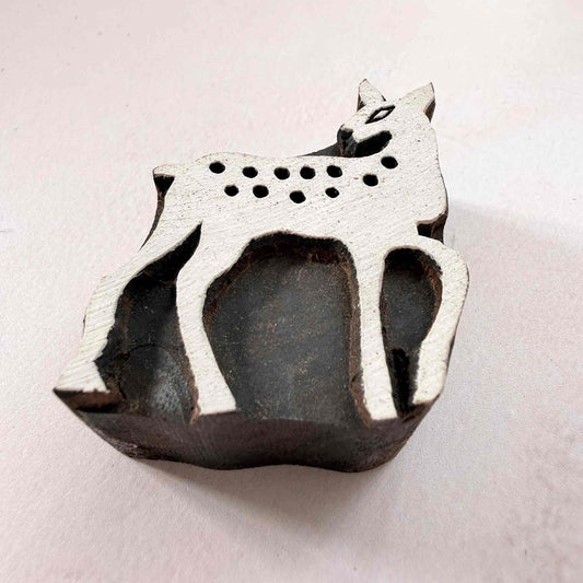 Indian wood block stamp — Bambi spotted deer viewed from side, showing carved depth and smooth fawn outline texture, handcrafted wooden stamp, premium traditional printing block hardwood