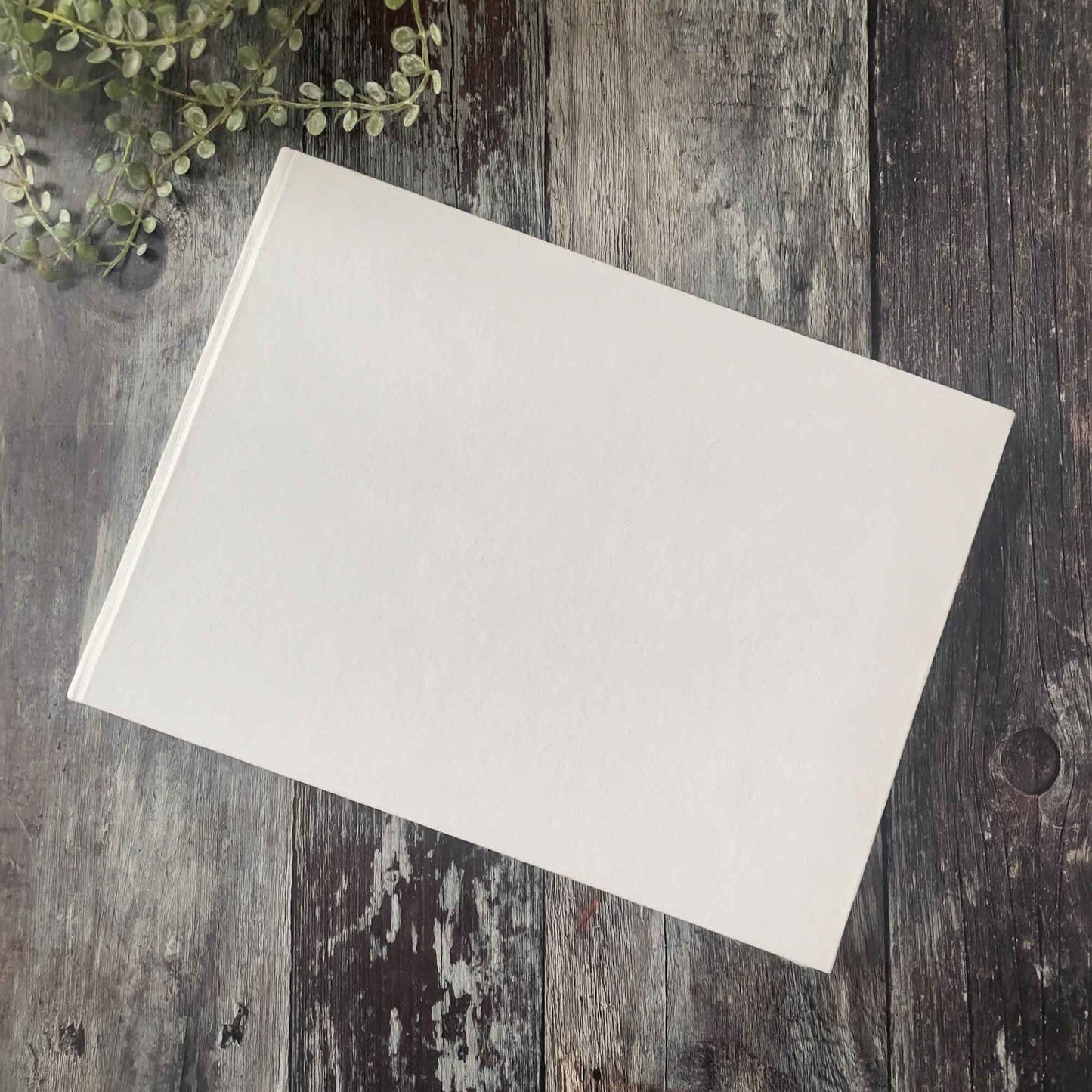 Blank white guest book with hard cover. A4 size made from handmade cotton rag paper