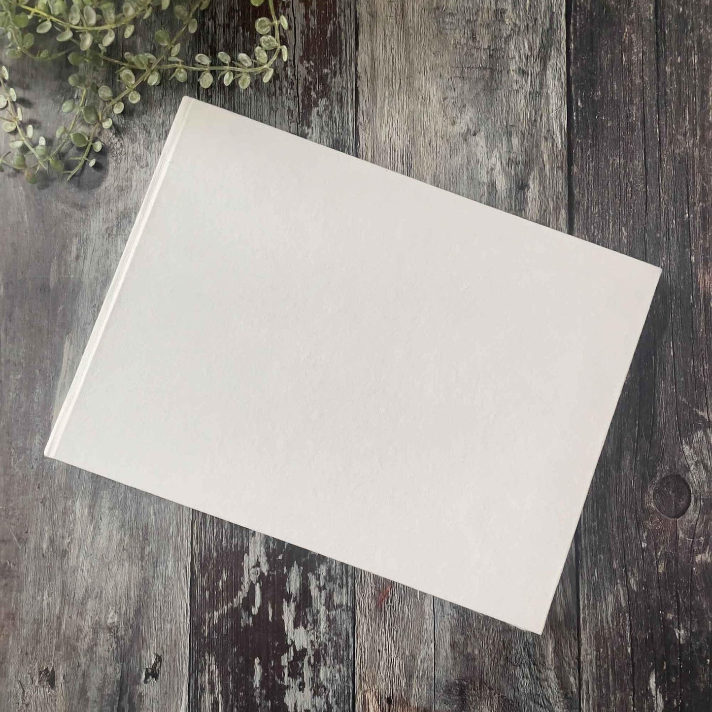 Blank white guest book with hard cover. A4 size made from handmade cotton rag paper