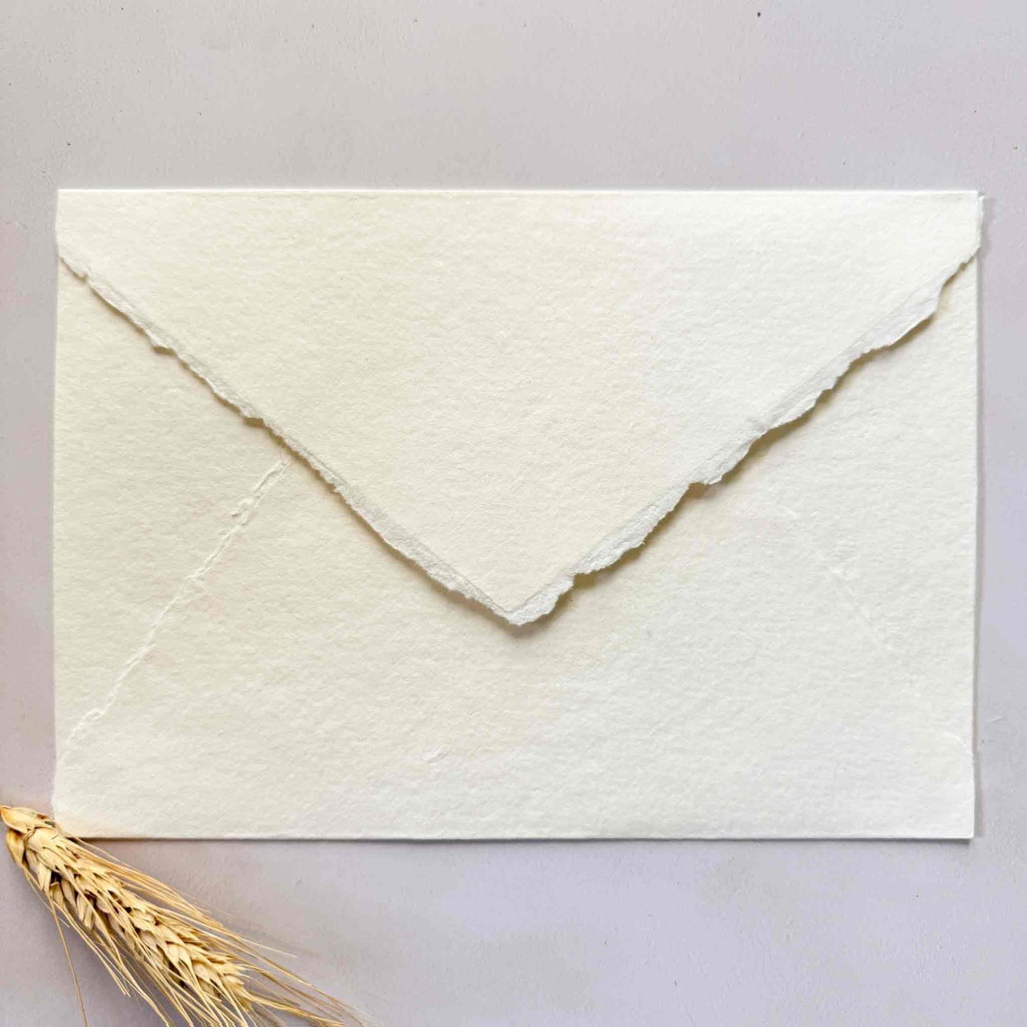 C5 handmade paper envelope in ivory with deckled edges