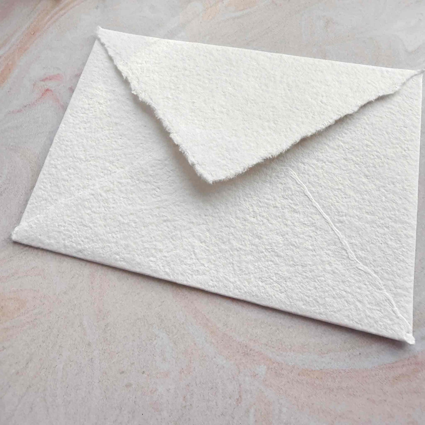 handmade cotton paper envelopes with deckled edges and pointed flap
