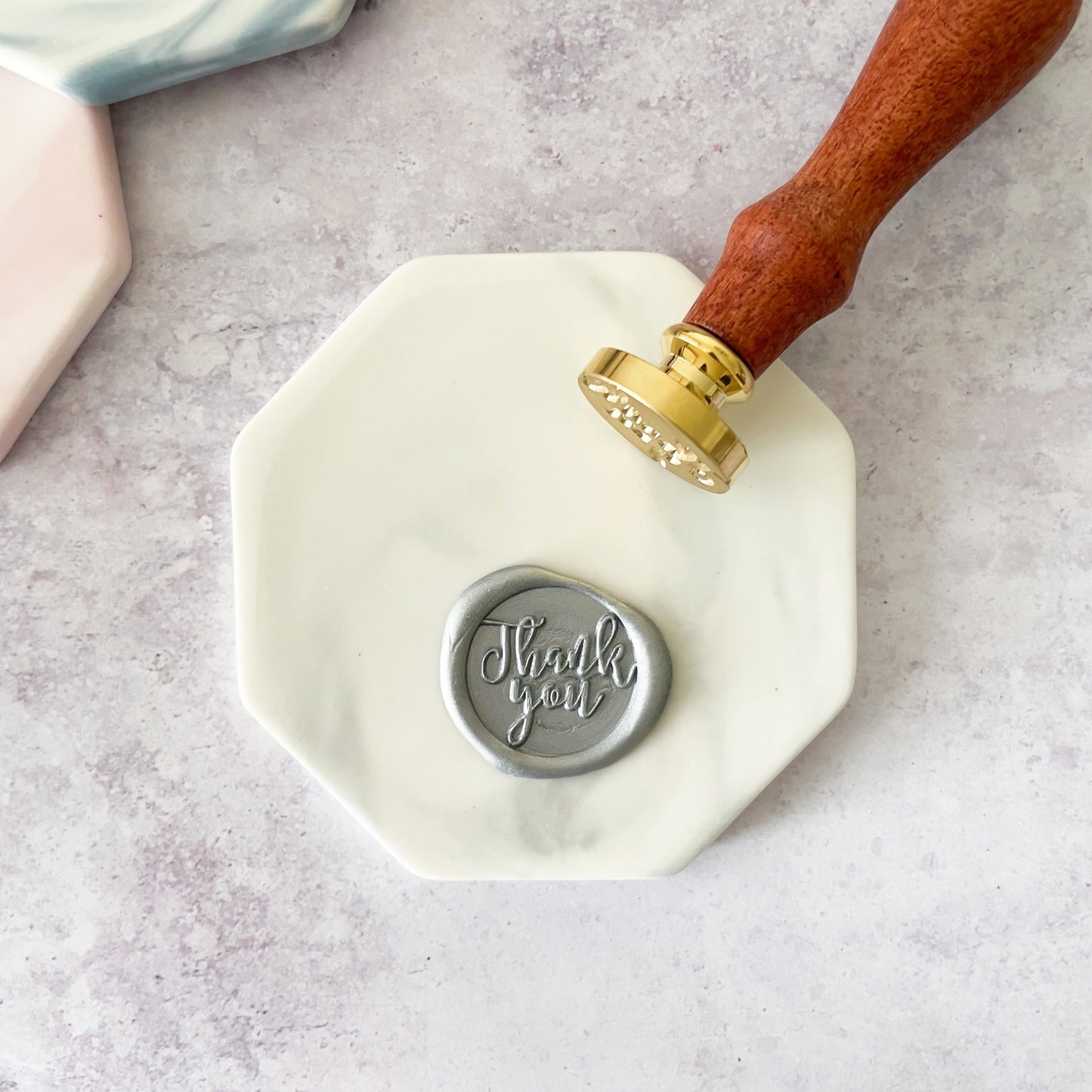 Ceramic wax stamp mat in white and grey. Make wax seals without mess with this specially designed hexagon shape tile with a marble finish. by The Natural Paper Company