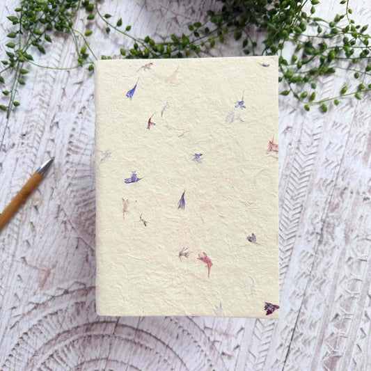 A5 eco‑friendly Lokta notebook, embedded with soft Cornflower petals, hand‑stitched binding, tree‑free and ethically produced in Nepal