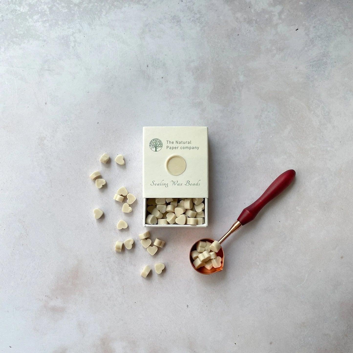 Cream sealing wax beads for making wax seals. Eco friendly wax for making envelope seals. By The Natural paper Company