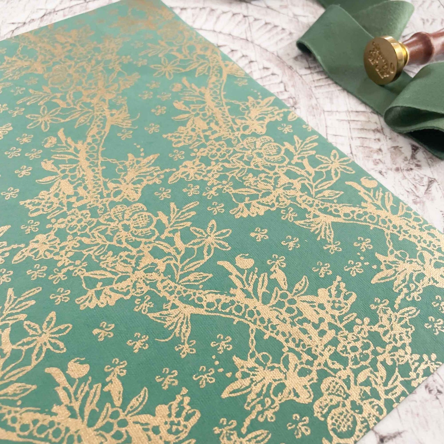 Green recycled cotton paper with gold pattern.  A4 patterned paper