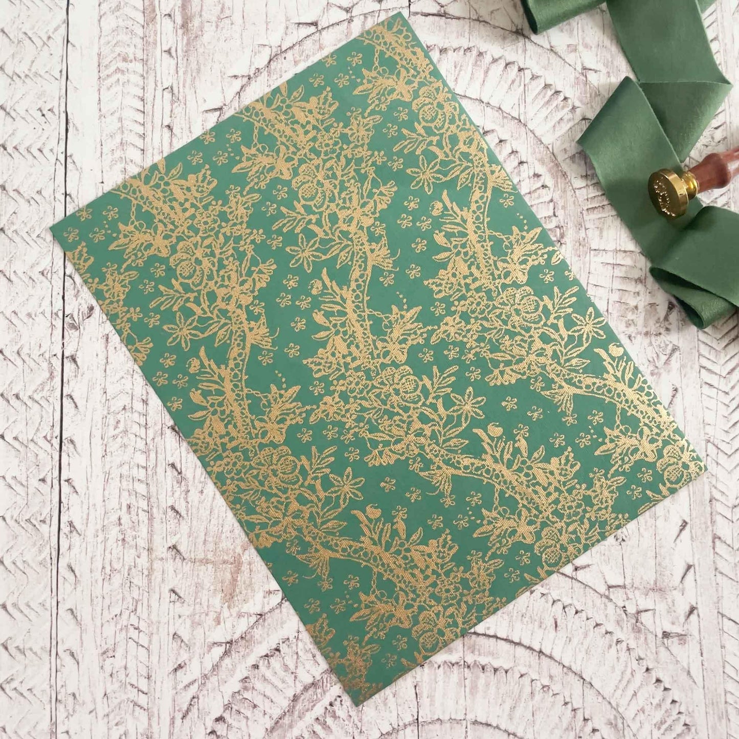 Decorative recycled paper with floral pwttern. Green and gold cotton rag paper