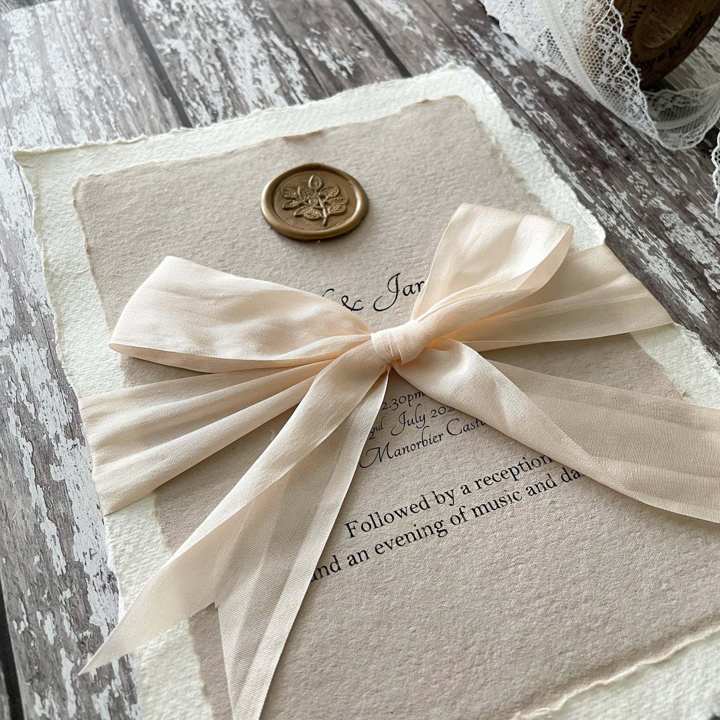 Wedding Invitation made with handmade recycled paper, silk ribbon and a wax seal. Eco friendly wedding invitation in natural materials and colours. Easy invitation to make at home. By The Natural Paper Company