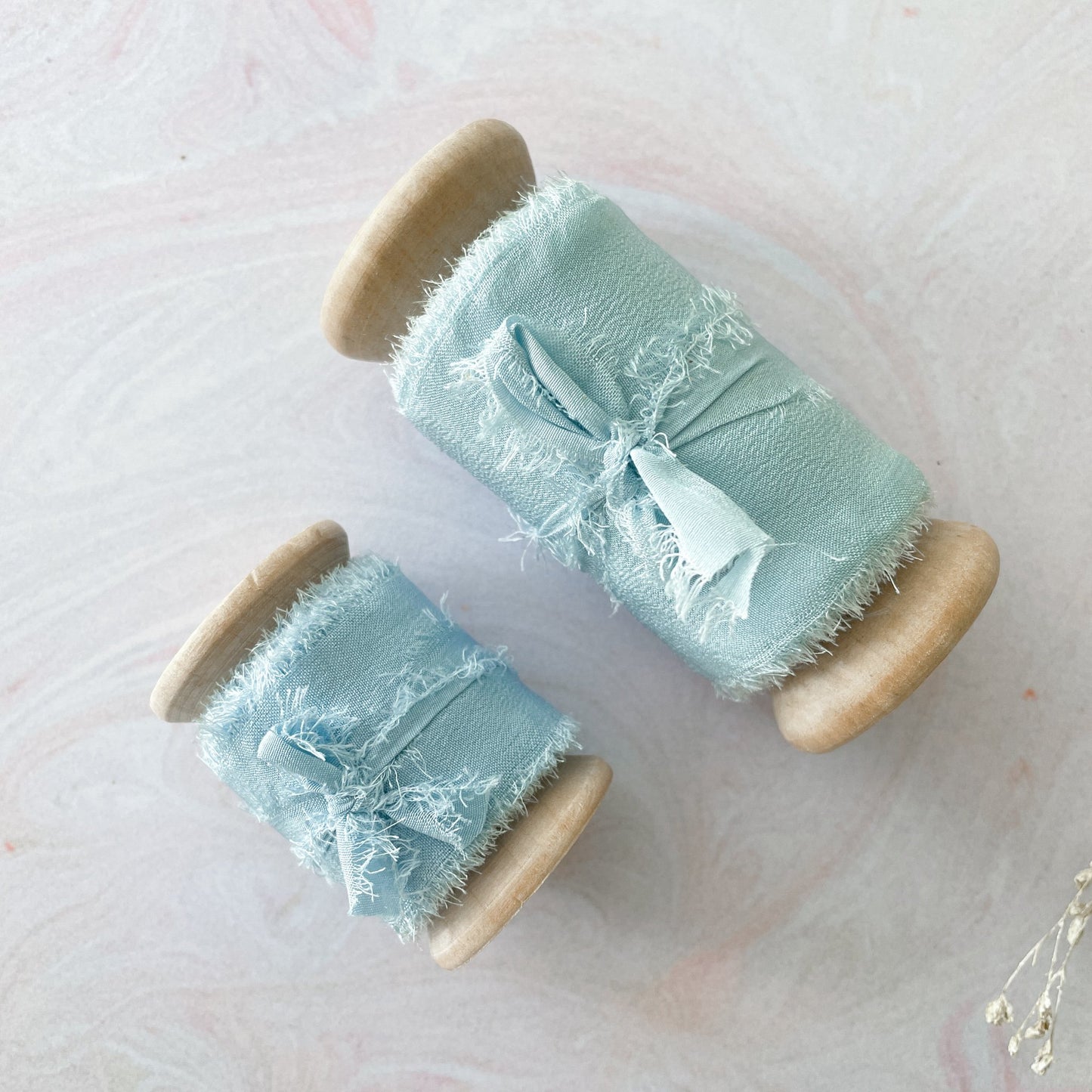 Pale blue silk ribbon for floristry and crafts. Luxury habotai silk ribbon By The Natural Paper Company.