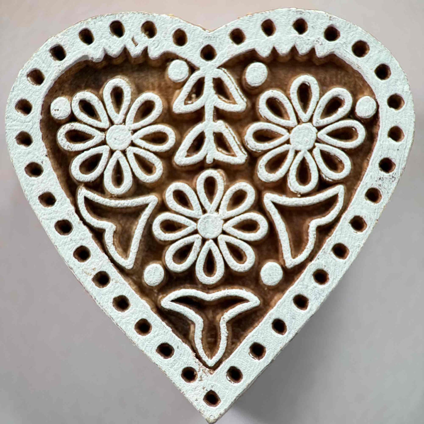 Heart-shaped wood block stamp with floral patterns