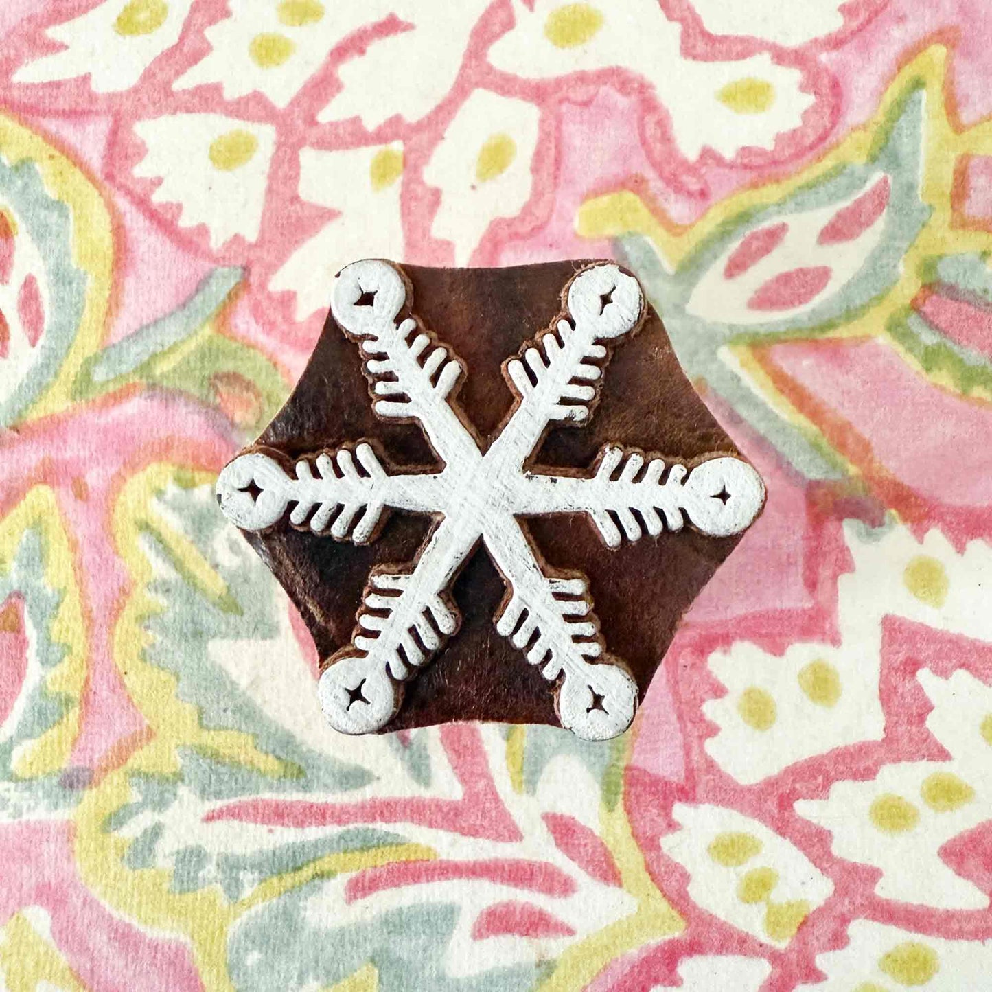 wooden stamp with snowflake pattern