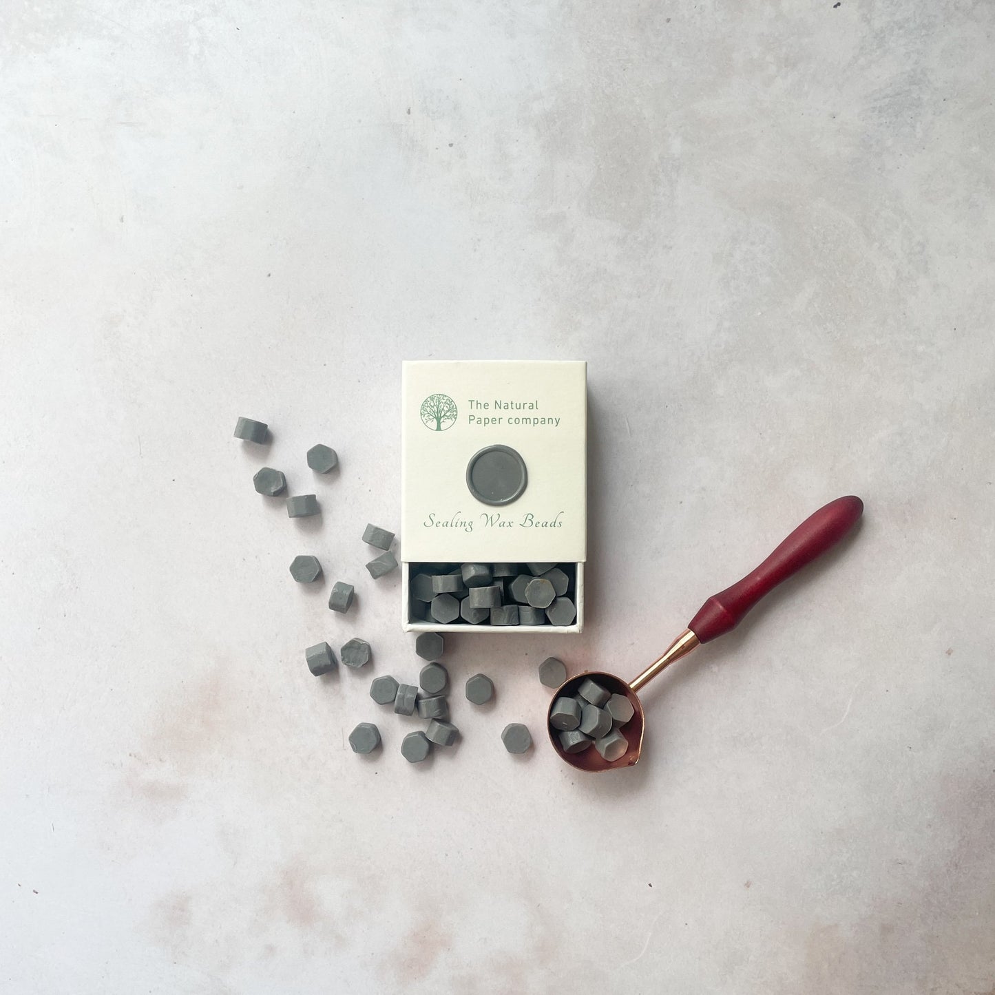 Eco friendly sealing wax beads in grey. Box of wax to make wax seals. Plastic free, paraffin free and biodegradable wax to make wax seals for wedding invitations, stationery, gift wrapping or packaging. By The Natural paper Company