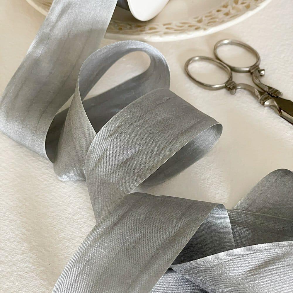 habotai silk ribbon in silver grey. Fine silk ribbons for craft. Closed edge silk ribbon sold by the meter. By The Natural Paper Company