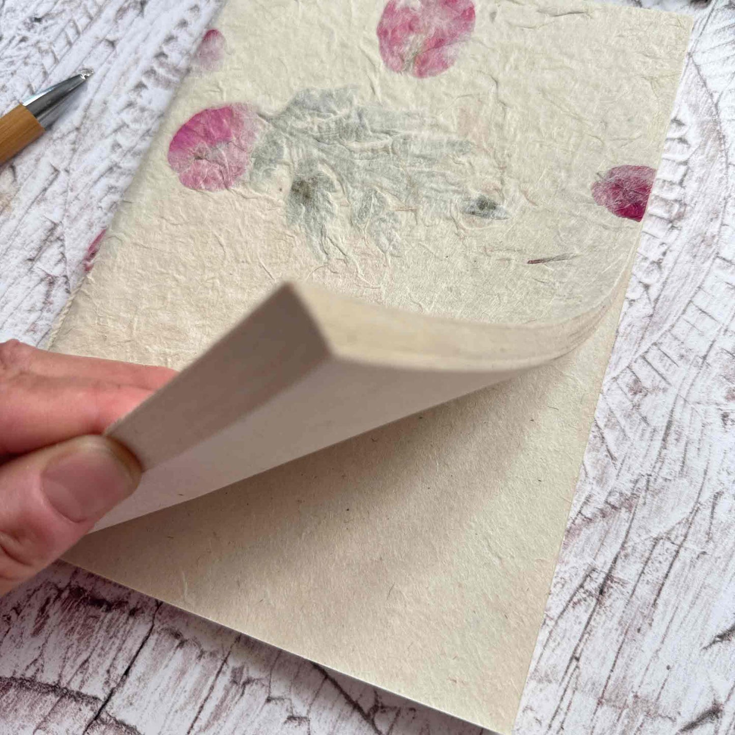 Close‑up of open Mugwort & Bougainvillea Lokta notebook, showing the soft, durable texture of acid‑free Lokta paper, handmade in Nepal