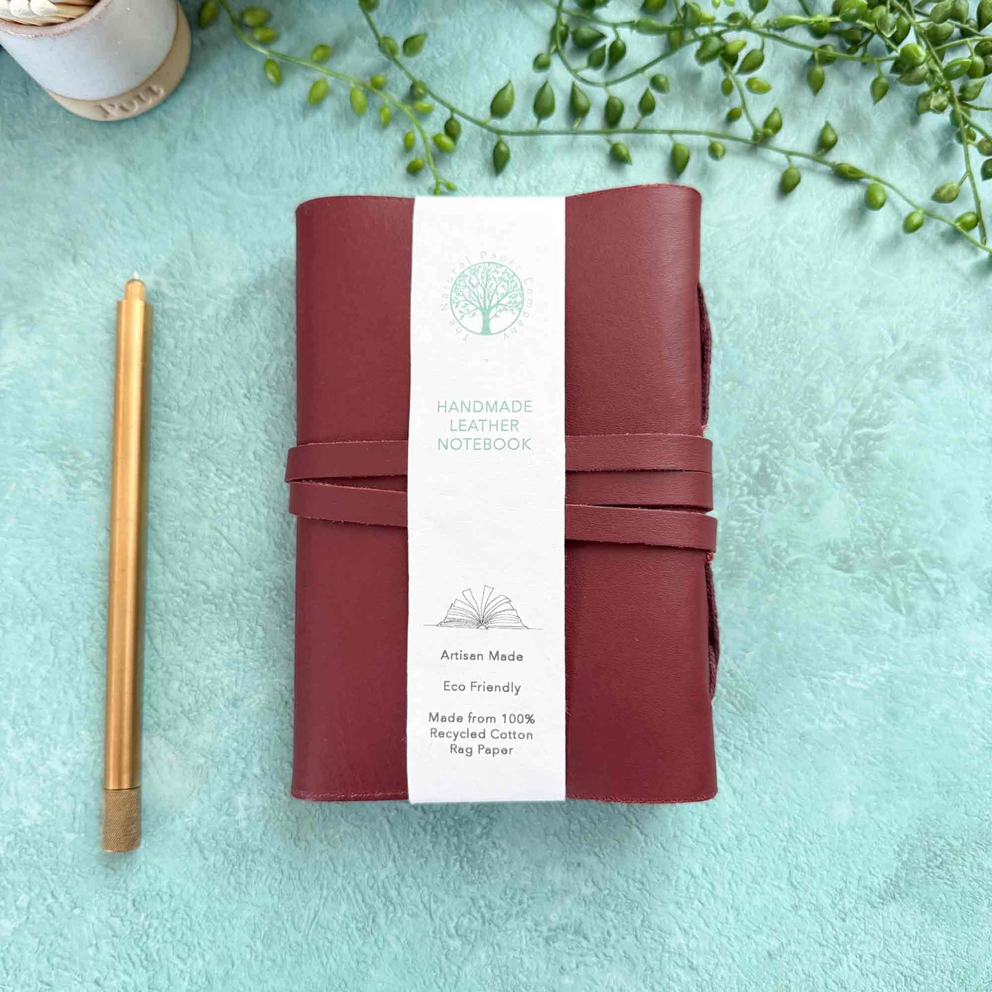 small handmade leather notebook in oxblood leather