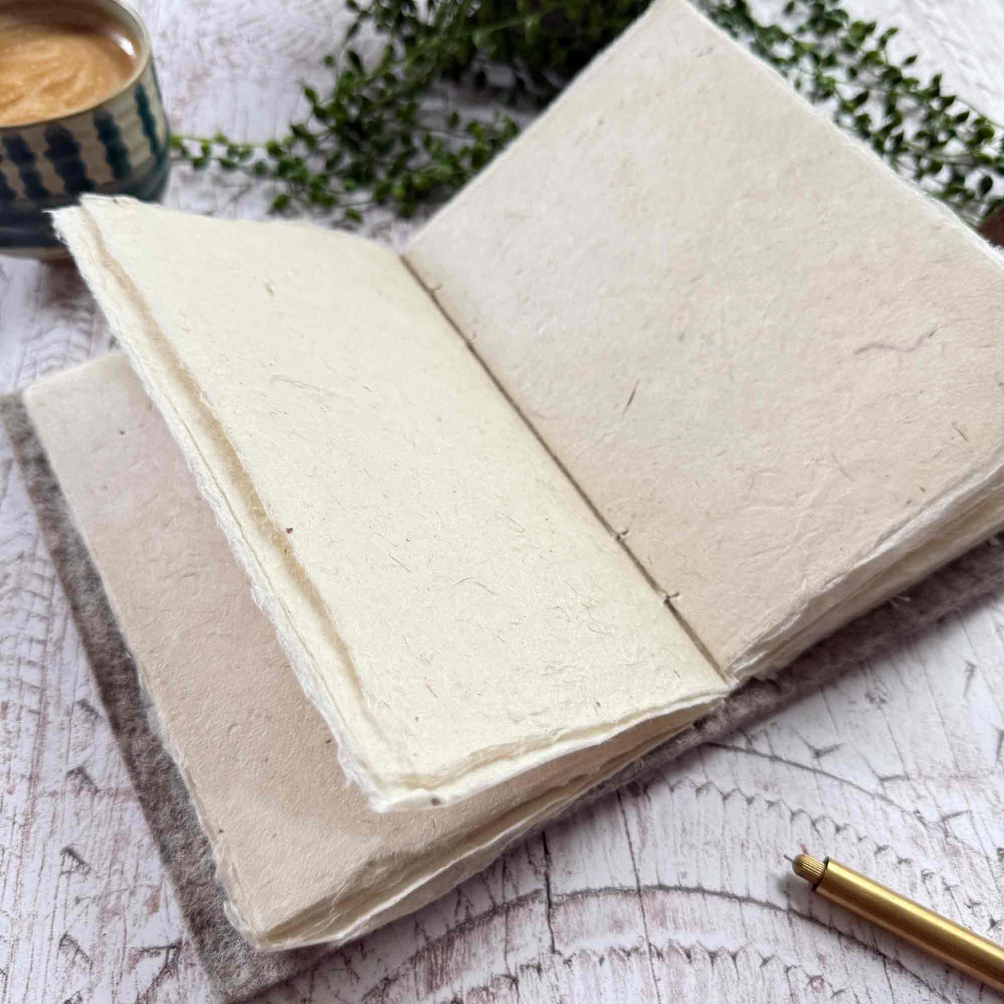 Close up of open A5 notebook with textured lokta paper pages