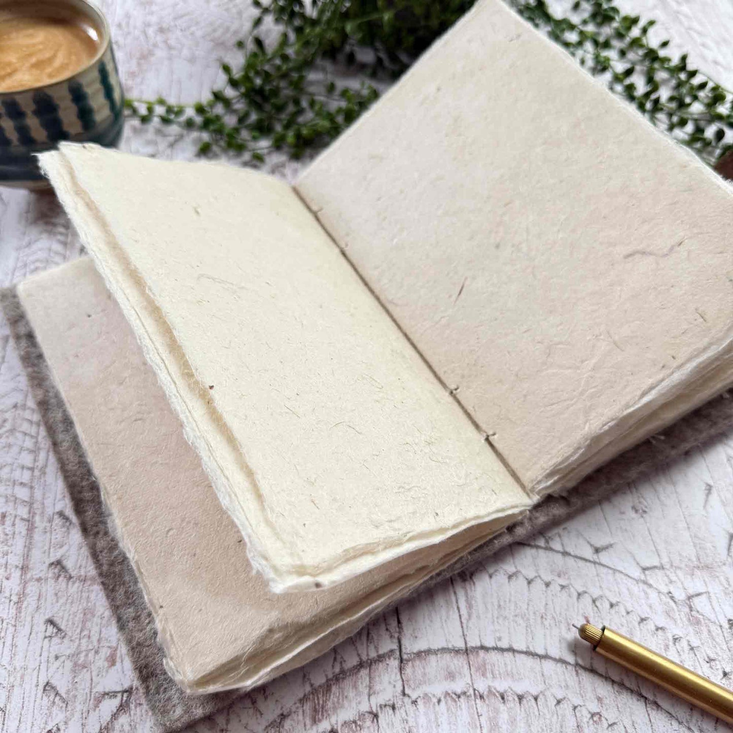 Close up of open A5 notebook with textured lokta paper pages