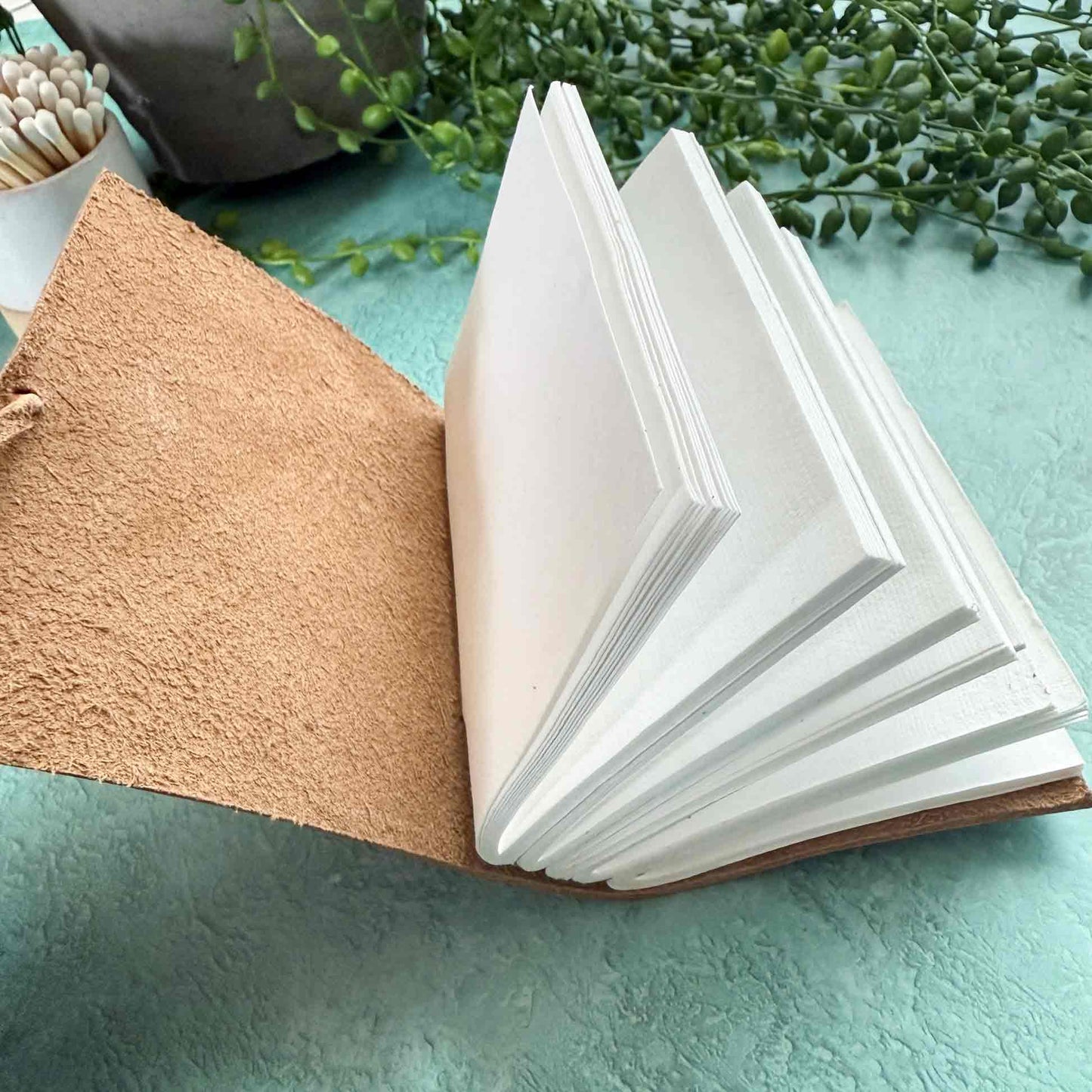 little handmade leather notebook in tan