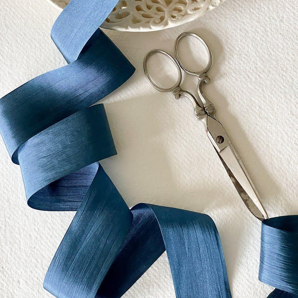 Navy silk ribbon for crafts. Fine habotai silk ribbon sold by the meter. Luxury silk ribbon with a closed edge. By The Natural Paper Company