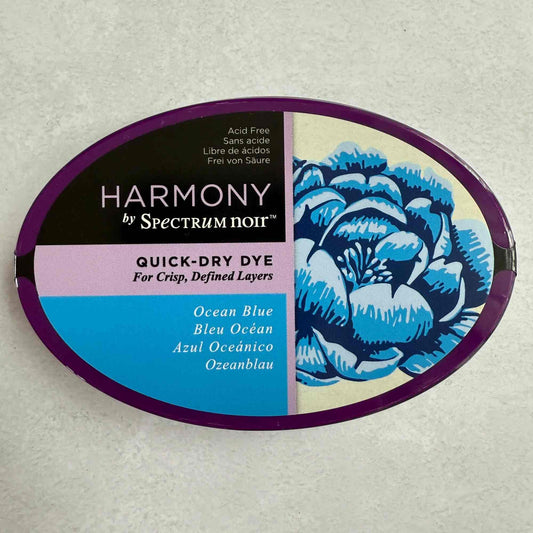 Harmony by Spectrum Noir quick-dry dye container with blue floral design on a gray background