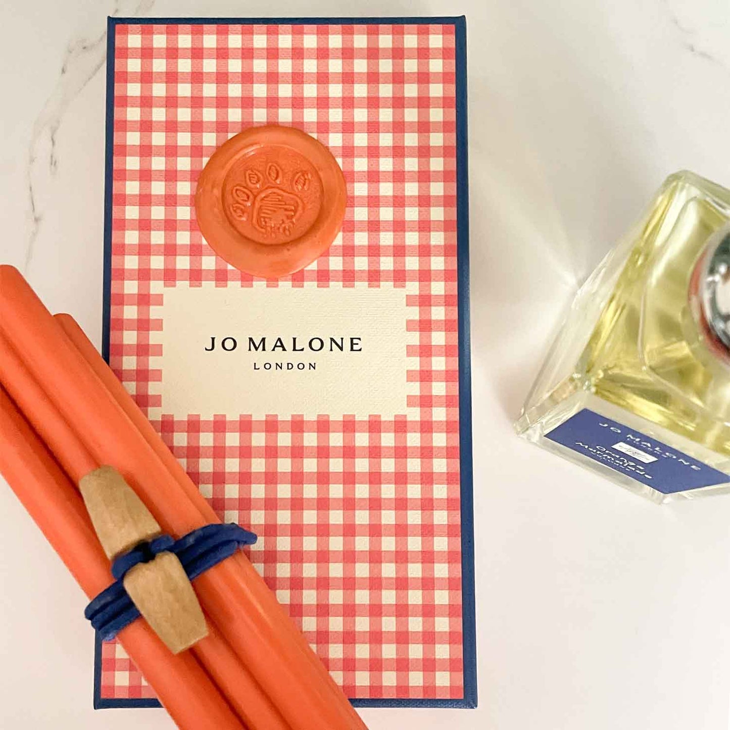 Orange marmalade sealing wax sticks to make wax seals.  Used for Jo Malone marketing campaign.  Eco friendly wax, plastic free, paraffin free and fully biodegradable.