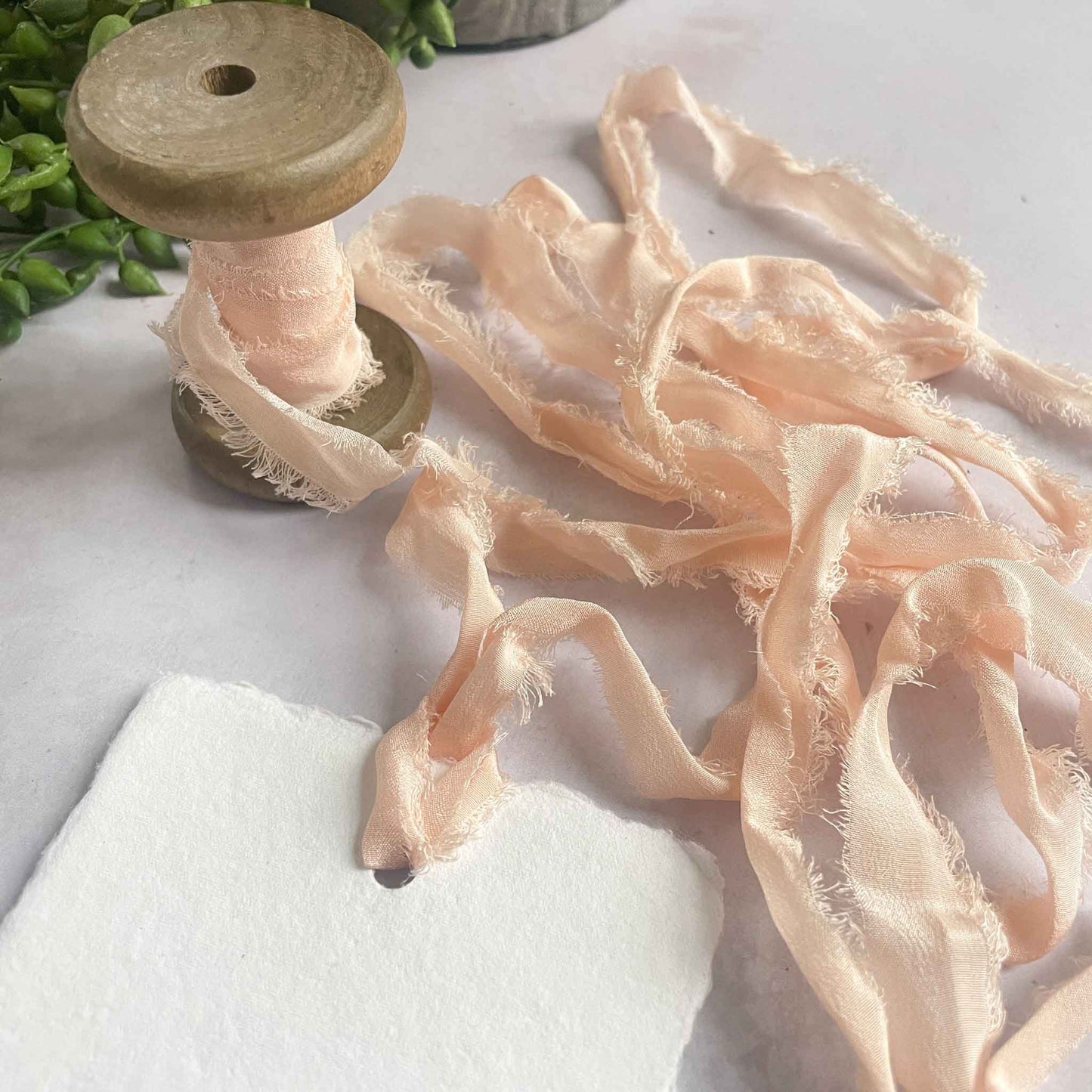 Peach Puff narrow silk ribbon with a raw edge. Silk ribbon for crafts