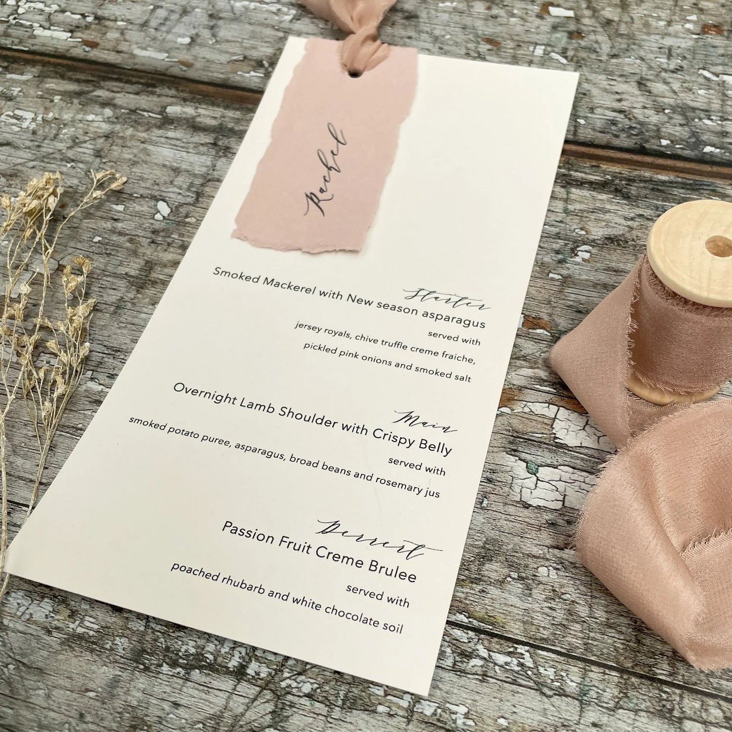 Make personalised wedding menu cards with handmade recycled paper and silk ribbon. Blush pink and ivory wedding menu card idea. By The Natural paper Company