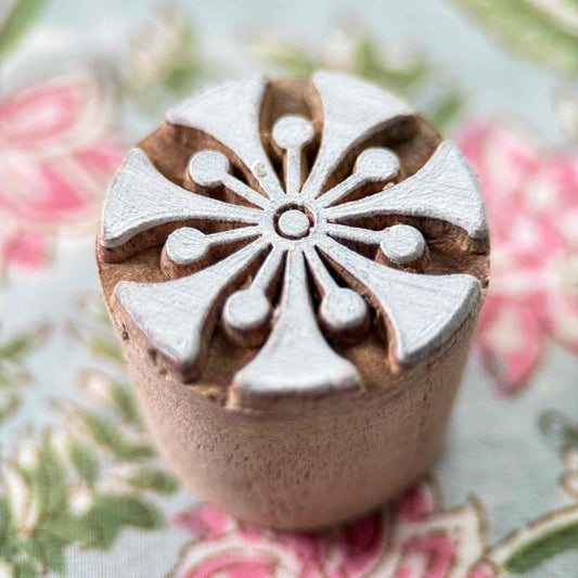 Decorative wood block stamp with a floral design