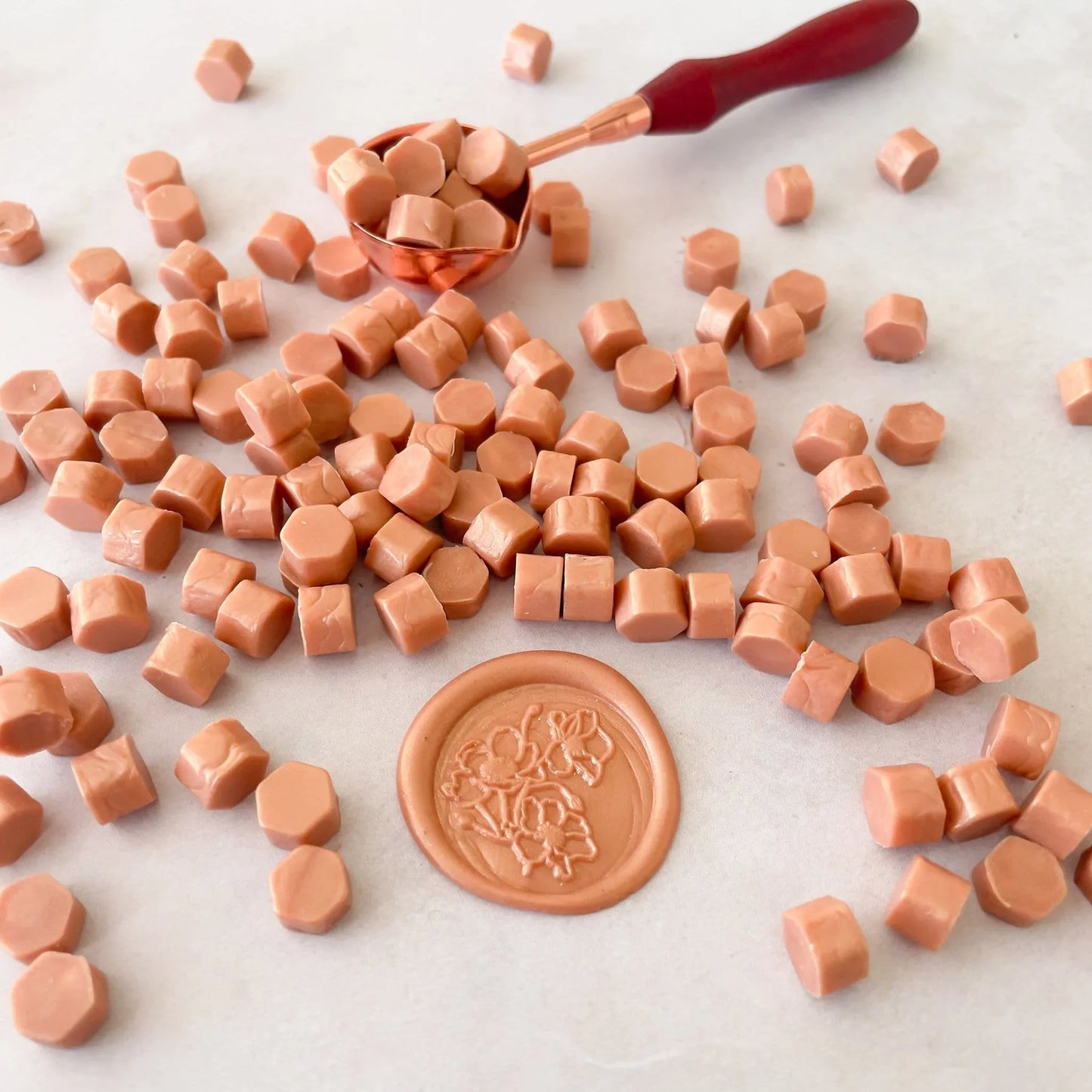 Rose gold sealing wax beads to make wax seals with a melting spoon. Eco friendly wax without plastic, paraffin free and biodegradable. by The Natural Paper Company