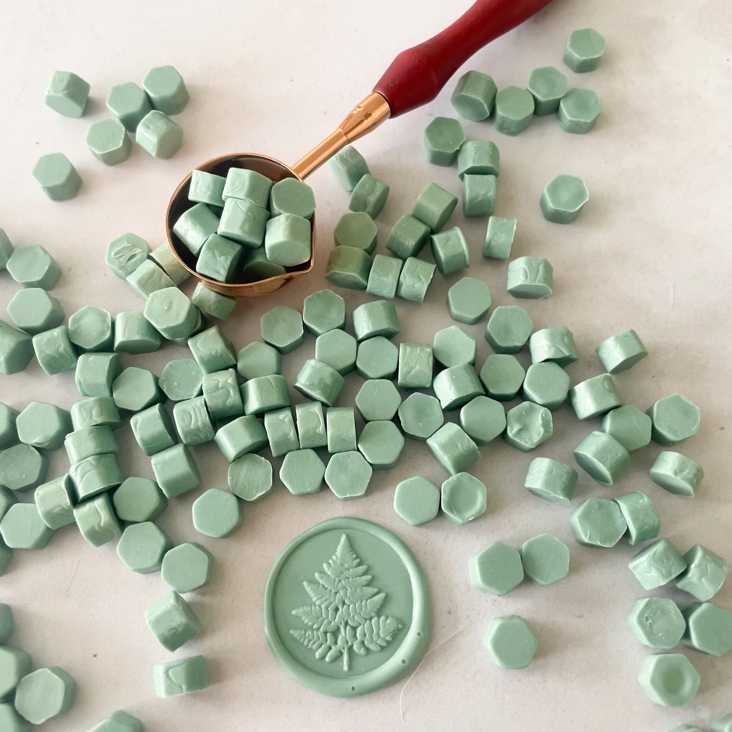 Sealing Wax Beads in Sage Green.  Eco friendly wax for making wax seals with a melting spoon and stamp.  Plastic free, biodegradable and paraffin free.  by The Natural Paper Company