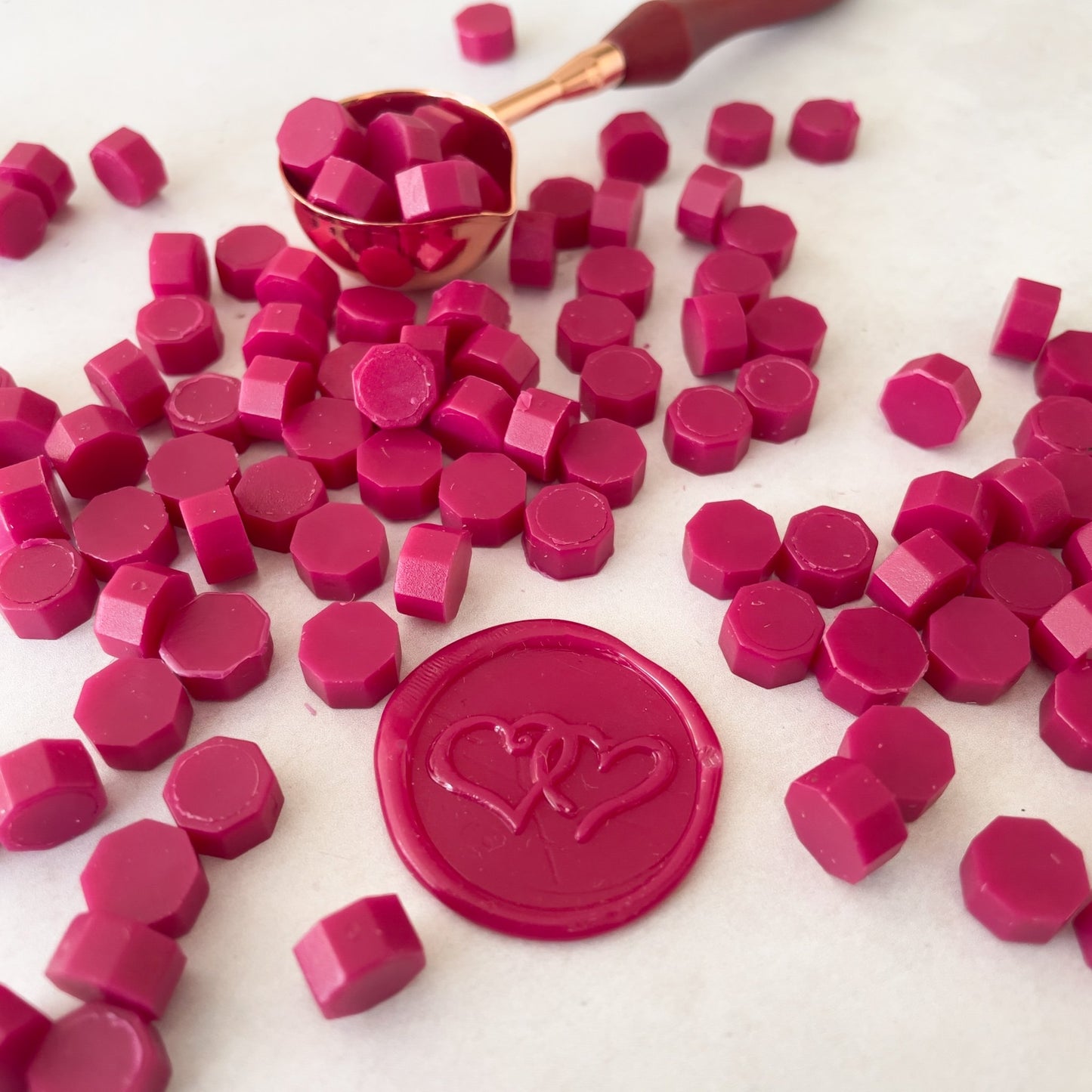 Eco friendly sealing wax beads in ruby red colour.  Bright red wax for making wax seals.  Plastic free, biodegradable and paraffin free.  by The Natural Paper Company