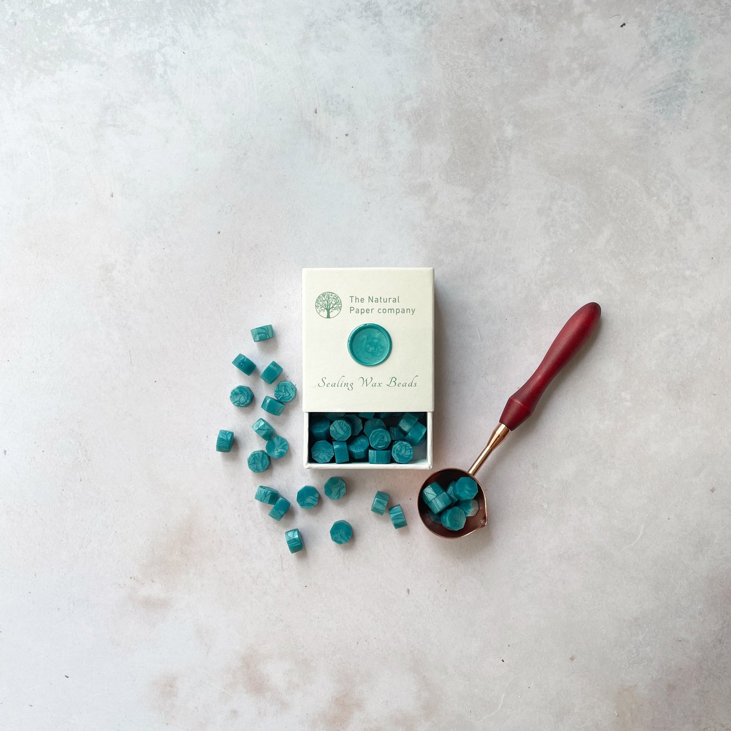 Sea green sealing wax beads to make wax seals with a stamp. Eco friendly wax for wax stamping. By The Natural paper Company