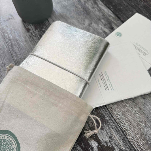 Silver leather journal presented in gift bag — ready for gifting