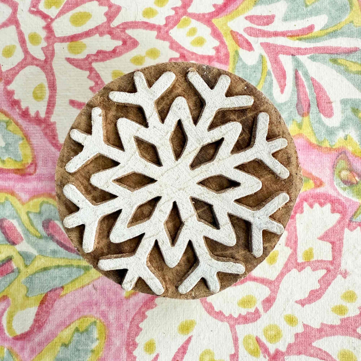 Festive wood block stamp with snowflake pattern
