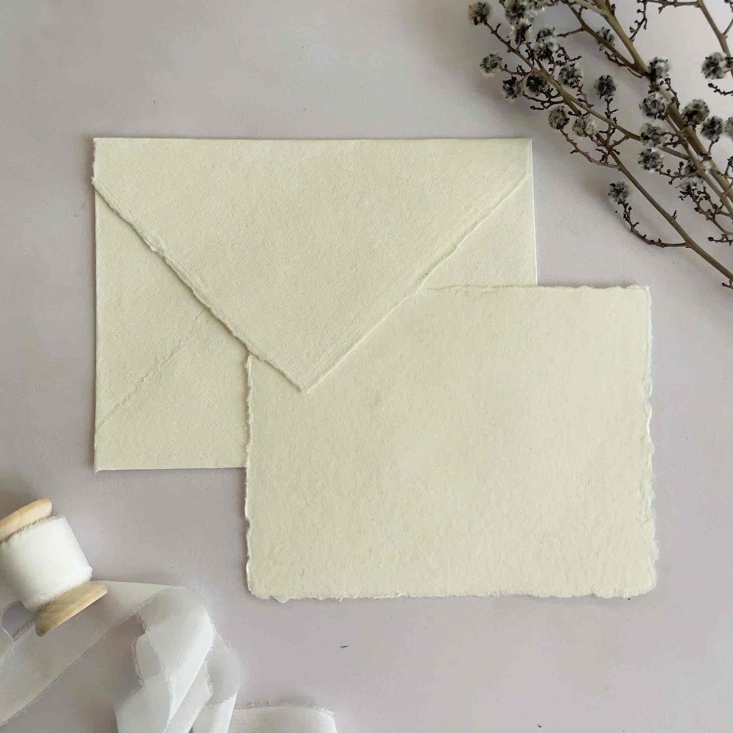 Cream handmade envelopes and card by The Natural Paper Company. Deckle edge stationery.