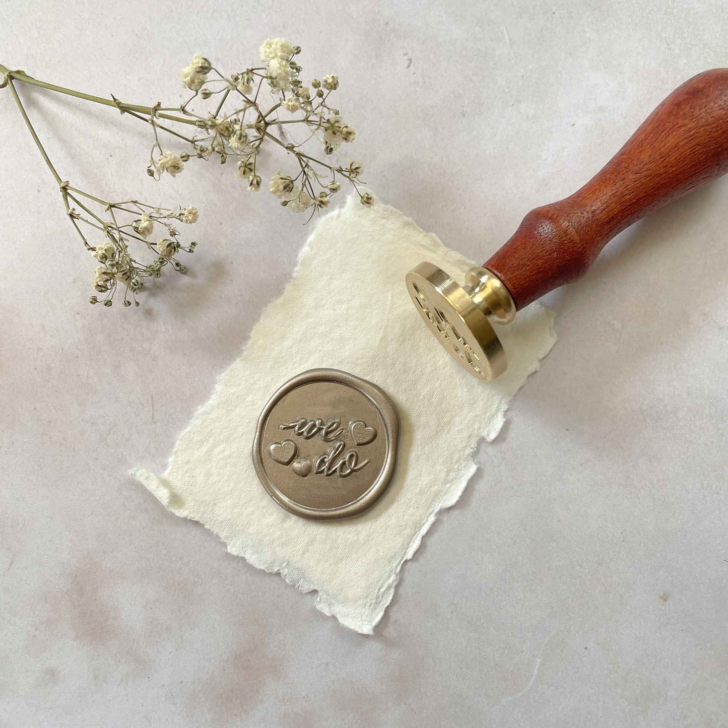 We Do wax seal stamp for decorating wedding invitations and engagement announcements. By The Natural Paper Company
