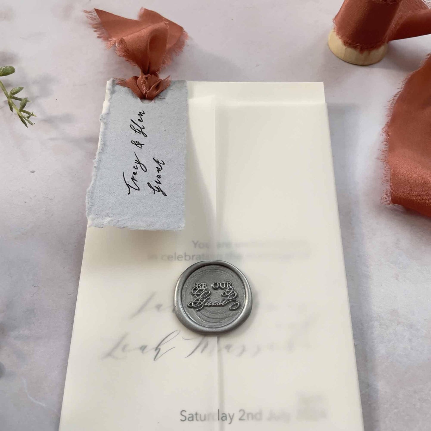 wedding invitation with silk ribbon and wax seal