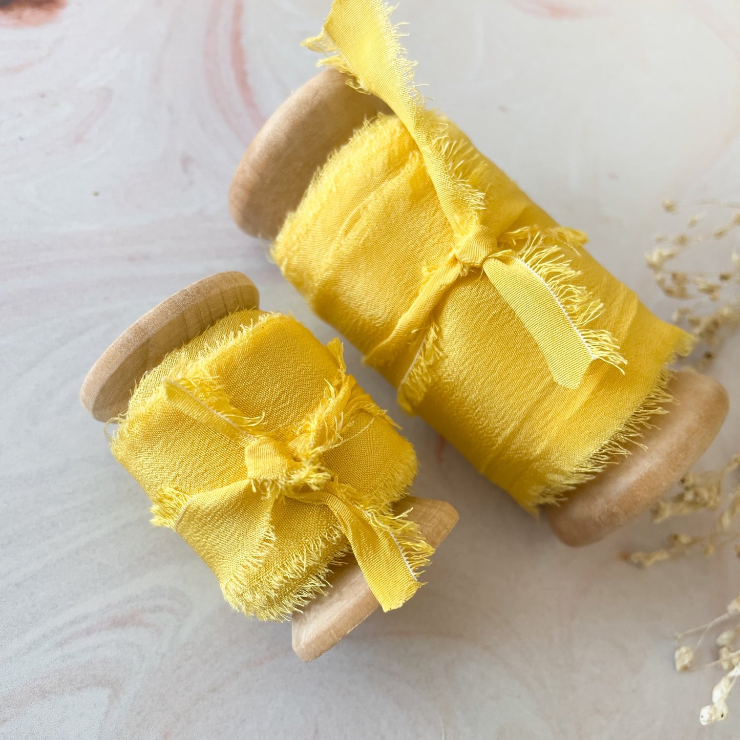 Yellow silk ribbon. Luxury ribbon for floristry and crafts. Perfect for decorating wedding stationery. By The Natural Paper Company.