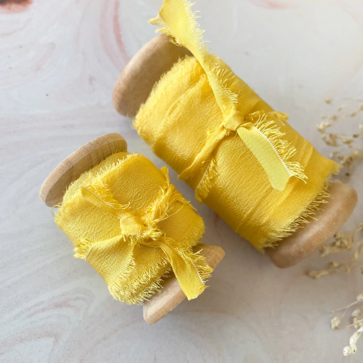 Yellow silk ribbon. Luxury ribbon for floristry and crafts. Perfect for decorating wedding stationery. By The Natural Paper Company.