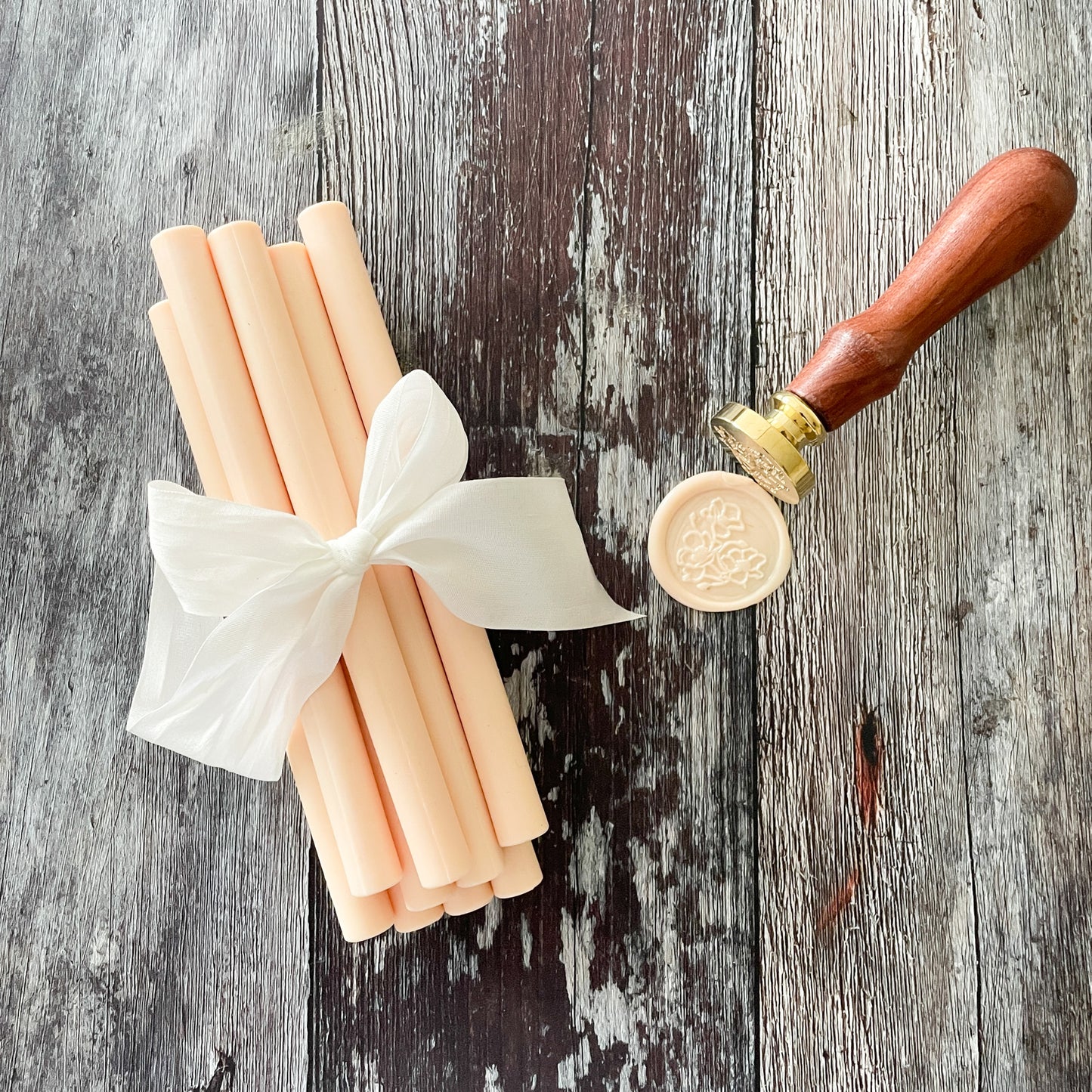 Peach sealing wax sticks.  Eco friendly sealing wax.  Plastic free, paraffin free and biodegradable.  11mm wax sticks to make wax seals with a glue gun or melting spoon.  By The Natural Paper Company