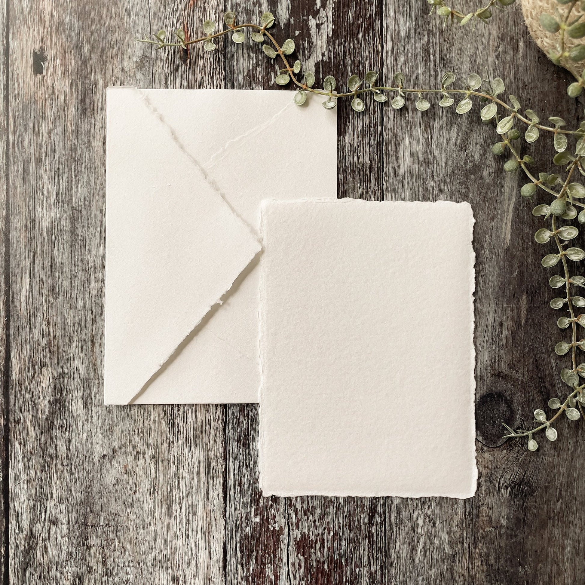 White handmade paper and envelope with a deckled edge.  Invitation card and envelope made from white recycled cotton rag paper.  By The Natural paper Company