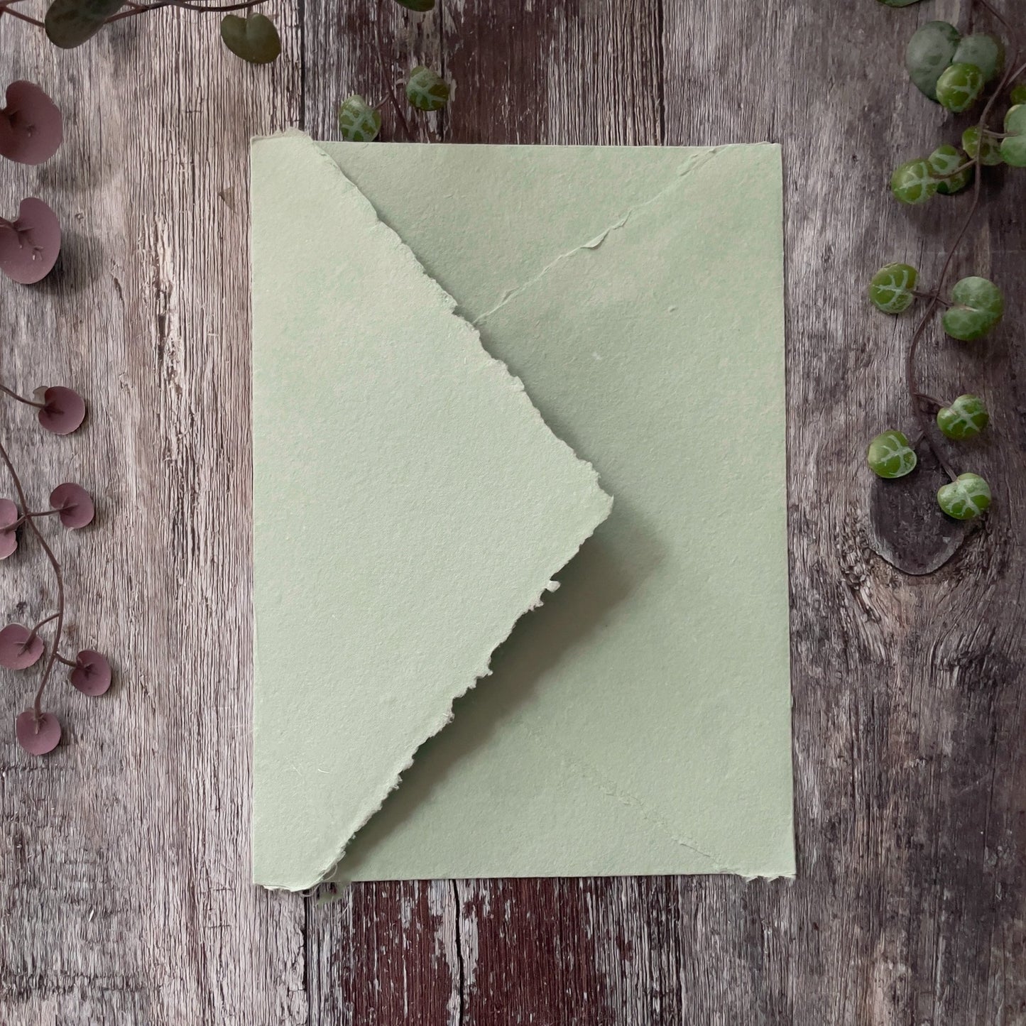 recycled envelope with a deckled edge pointed flap.  Dusky green invitation envelope handmade from recycled cotton rag paper.  By The Natural paper Company