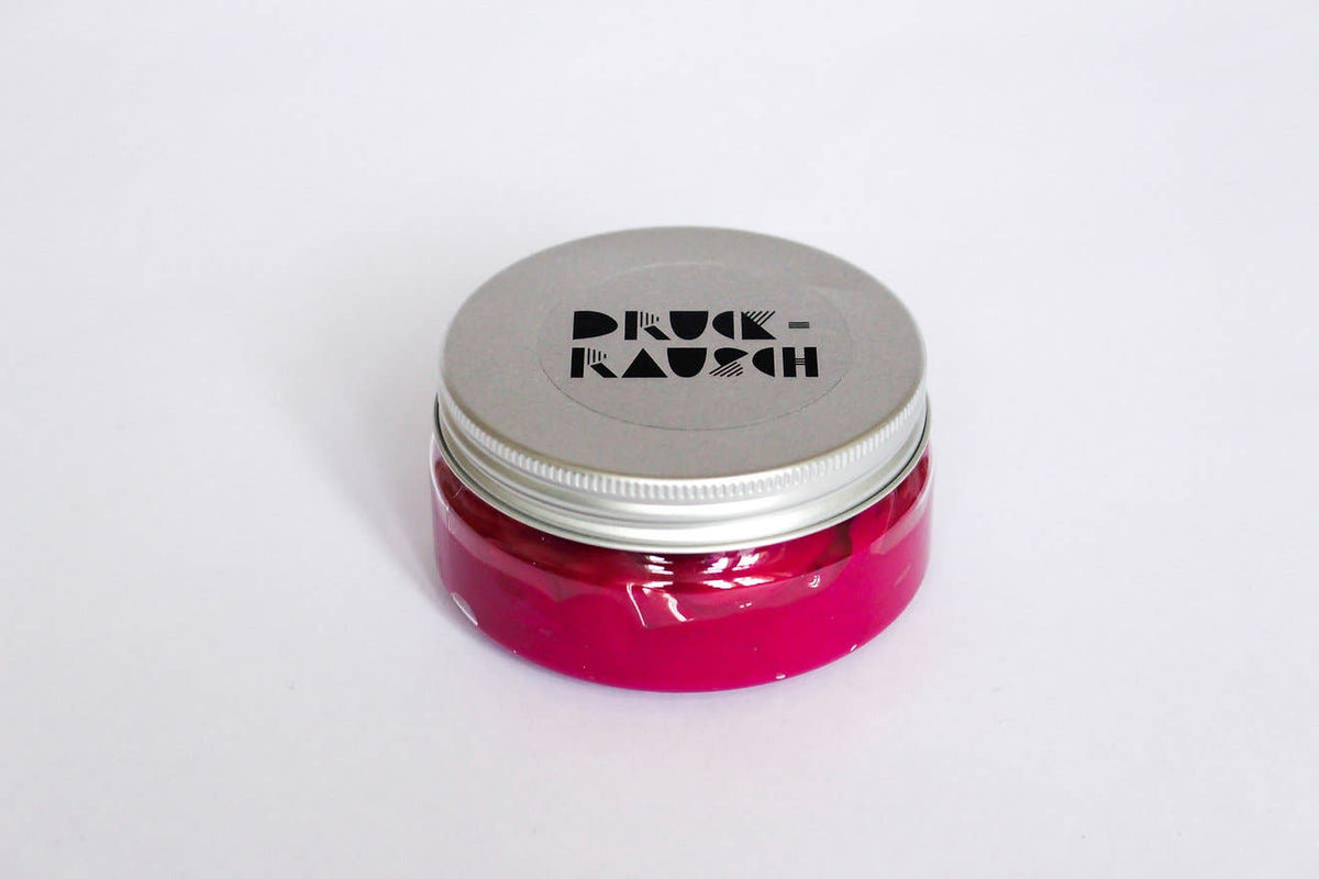 small pot of fuschia pink fabric printing paint