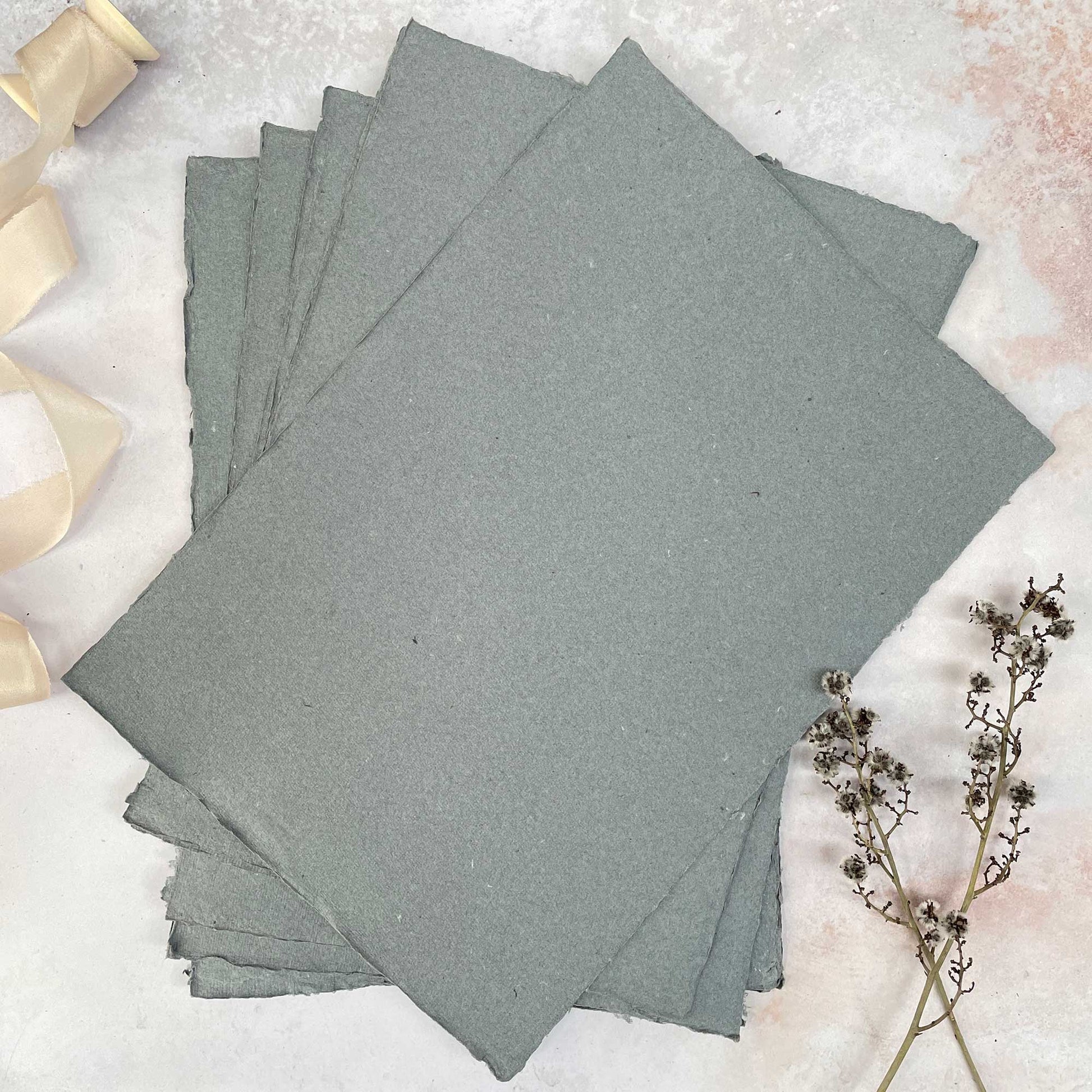 a4 sheets of dark grey handmade paper with deckled edge.  Made from recycled cotton rag fibres